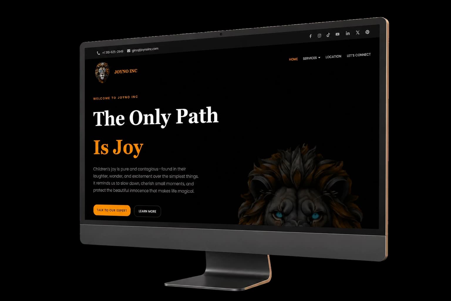 Joyno Inc. corporate website displayed on a real all-in-one monitor